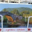 P014-223 ... a postcard of Wales (Cymru in Welsh) - recognize the setting? ( Llanrwst, River Conwy-Pont Fawr-Tu Hwnt i’r Bont) - Y Ddraig Goch/the Red Dragon has long...