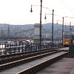 P005 ... the considerably larger Pest spreads out on a flat and featureless sand plain on the river’s opposite bank... (foreground - tram along Danube Promenade, and...