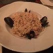 P003 ... seafood risotto - fresh calamari, shrimp, and mussels steamed in a reduced shellfish stock...