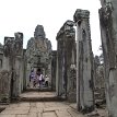 P010 The Bayon is surrounded by two long walls bearing an extraordinary collection of bas-relief scenes of legendary and historical events.