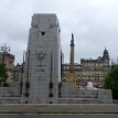 P011-015 ... rear wall of the cenotaph has an Imperial coat of arms carved in relief and a set of six bronze wreaths attached to ﬂagpoles - George Square as viewed from...