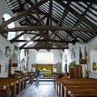 P008-028 ... five arches rising from ground level of the church arcade and four arches above, arcade not reaching the ridge of the roof but ending in the upper tie beams...