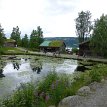 P018 ... Skjåktunet, four farmstead buildings from Skjåk on the farmyard - Lykrestua, a ramloftstue from 1764; Hjeltarstua, ramloftstue from 1763; Vigstadstua, a...