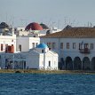 P005 ... waterfront... the Town Hall of Chora and the beautiful blue-dome white-washed small temple of St Nicholas of Kadena...