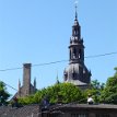 P003b-2a ... cathedral's lower end surrounded by the Bazaar (Basarene ved Oslo domkirke), a curved long building with miniature towers with silvery-green copper top; the...