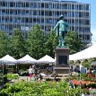 P023 Statue of King Christian IV unveiled in 1880 at Stortorvet Square, across the street to the west of Oslo Cathedral; beautiful flower market at the square in the...