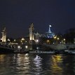 Pic 002 Sculpted socle columns of Pont Alexandre III (arch bridge) and the Grand Palais (Great Palace) with glass dome