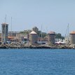 P000d Mandráki, the (ancient) harbor, is distinguished from the outer harbor by the 3 windmills and the fortifications at the end of the dock...