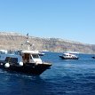 P005a1 ... tender boats getting ready to tranport guests from the cruise ship to the ferry port of Athinios, at the west side of Santorini island...