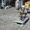 P008c01 ... statue of a sad-looking donkey on the roadside of Fira... poor donkey must be very tiring after carrying tourist(s) up to the town back and forth the steep...