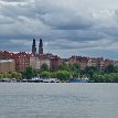 P029 ... the twin towers of Högalidskyrkan (Högalid Church) built 1916-1923, on the northwestern side of Södermalm island; docks and residential buildings along...