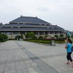 P002 ... our local tour guide leading the way to the Main Exhibition Hall - building with the exhibition of the Tomb of Marquis Yi of Zeng state and the chime...