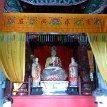 P024 ... statue of Buddha Mulian and his two disciples, Temple of Gratitude; it's said that the dog underneath the lotus pedestal is his mother 報恩殿...